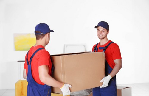 Loading furniture into a van in Cricklewood