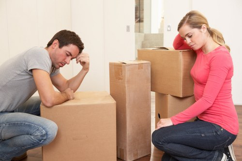 Removal team handling stairs during a Cricklewood apartment move