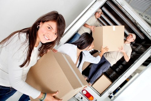 Family storing household items with mobile self storage in Cricklewood