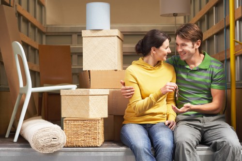 Professional removals team handling furniture in Cricklewood